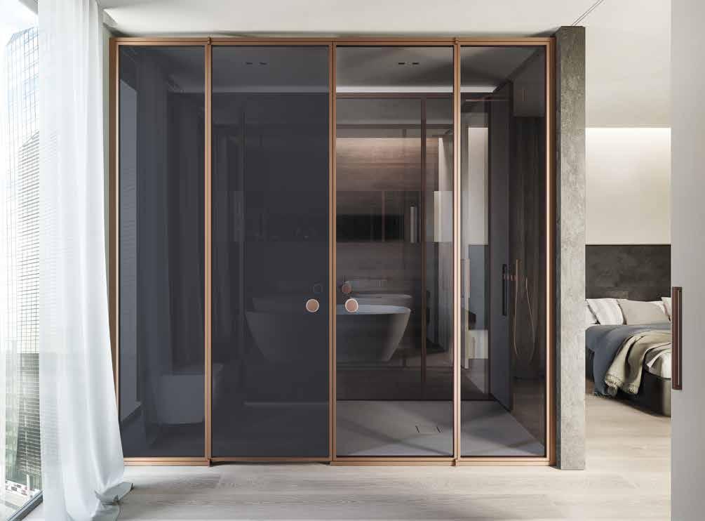 Suite with satin grey and transparent glass and matt-finish copper frame.