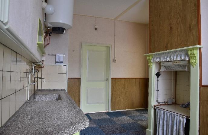 In de jaren zestig is achter het huis een bijkeuken aangebouwd met wc